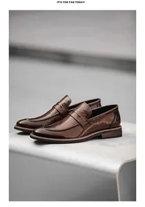 Detailed shot of classic brown leather loafers with elegant penny strap and pointed toe