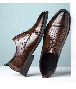 Detailed view of breathable brown perforated leather derby shoes for business formal wear