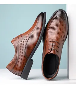 Close-up of brown leather business dress shoes featuring breathable perforated design.