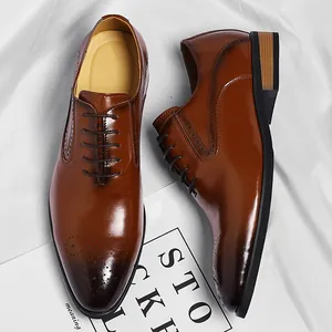 Classic brown leather oxford shoes for men featuring elegant brogue detailing.