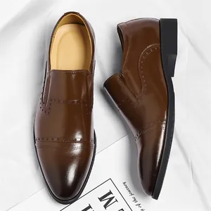 Classic brown leather Oxford shoes for men with brogue detailing in a formal business style