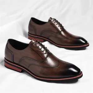 Elegant men's brown gradient wingtip Oxford dress shoes for formal business and weddings.