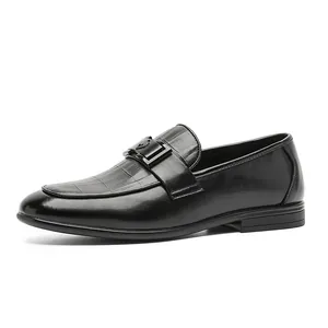 Classic black British style men's leather loafers with textured vamp and buckle detail