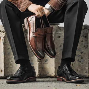 Classic British style men's leather penny loafers shown in brown and black variants
