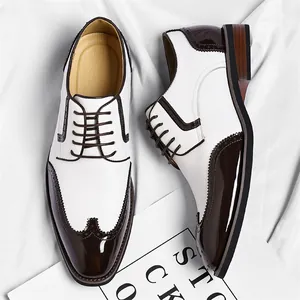 Classic white and dark brown men's Brogue dress shoes with elegant wingtip carving details
