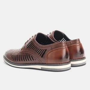 Detail of mens brown breathable hollow-out leather shoes with stylish perforated design