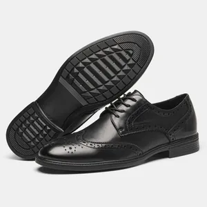 Detailed view of black genuine leather Brogue shoes with intricate carving and non-slip sole