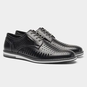Detailed side view of black perforated breathable men's leather shoes with lace-up design