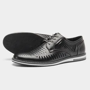 Detailed macro view showing the breathable hollow-out design of men's black leather shoes