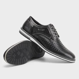 Detailed view of breathable black hollow-out men's leather shoes in British style