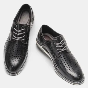 Detailed view of men's black hollowed-out breathable leather dress shoes for summer.