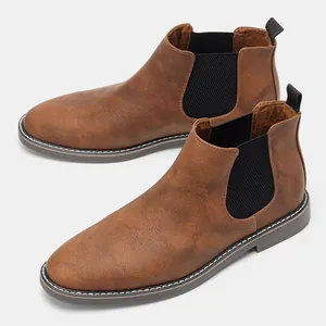 Detailed view of vintage brown men's Chelsea boots featuring elastic side panels.