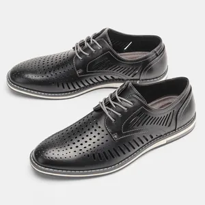 Close-up detail view of men's breathable black hollow-out leather dress shoes for summer