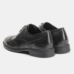 Rear view of black leather Brogue dress shoes with wingtip perforation details.
