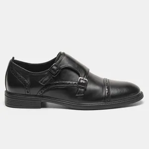Detailed side view of black genuine leather double monk strap brogue dress shoe.