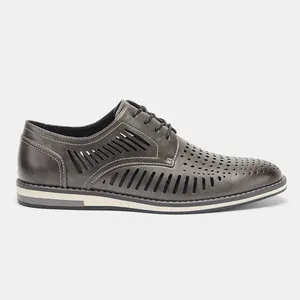 Detail side view of men's breathable hollow leather dress shoes in a stylish grey color