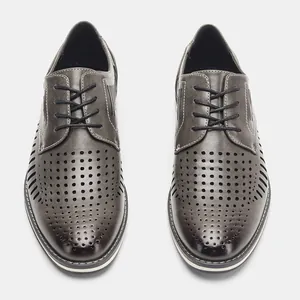 Top view of grey perforated men's summer leather dress shoes with breathable hollow design