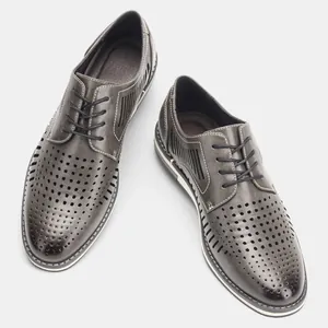Detailed view of grey men's breathable perforated leather derby shoes for summer season