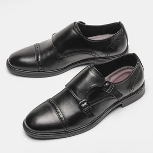 Detailed view of high-quality black genuine leather monk strap brogue dress shoes