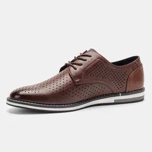 Side view detail of brown men's perforated leather dress shoes with breathable brogue design
