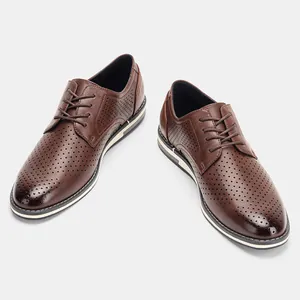 Detailed close-up view of brown perforated men's dress shoes with a breathable design.