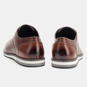 Detailed rear view of brown breathable leather shoes featuring a stylish hollow-out design