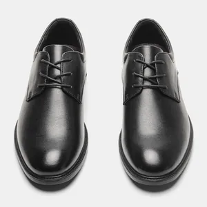 Top-down view of classic black genuine leather Derby shoes for business formal occasions
