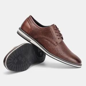 Close-up detail of stylish brown perforated breathable leather Oxford shoes for men
