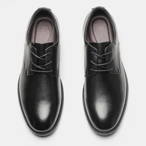 Top view of classic black genuine leather Derby shoes with refined lace-up detail.