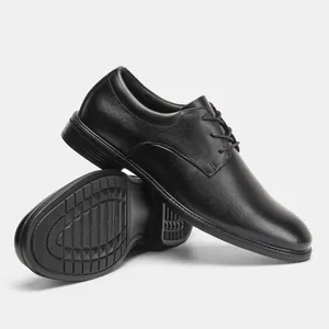 Close-up of elegant black leather Derby shoes showing polished finish and sole detail