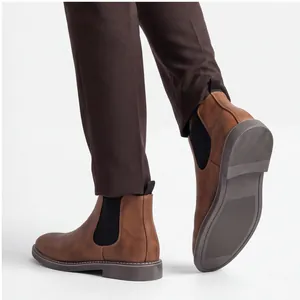 Men's classic brown Chelsea boots with elastic side panels for casual business wear.