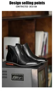 Detailed side view of black men's leather Chelsea boots featuring a functional side zipper