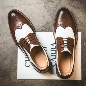 Classic brown and white wingtip brogue dress shoes for men with elegant lace-up design