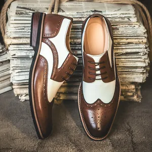 Classic men's brown and white two-tone wingtip brogue dress shoes with lace-up design
