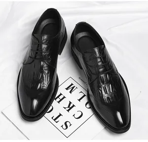 Detailed top-down view of black crocodile pattern leather elevator dress shoes