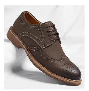 Detailed side view of brown men's wingtip Brogue dress shoe with elegant perforation patterns