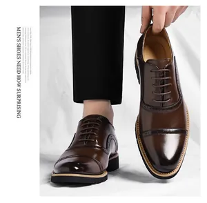 Classic dark brown men's business leather shoes with elegant brogue detail and laces