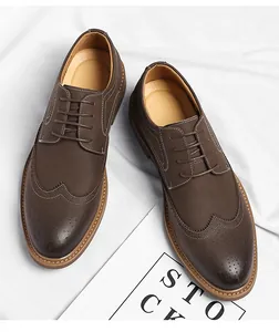 Detailed overhead view of brown men's Brogue shoes with wingtip carving details