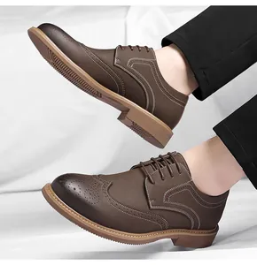 Detailed side view of premium men's brown Brogue business shoes with wingtip carvings
