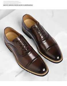Macro view of brown leather business shoes featuring elegant brogue wingtip details