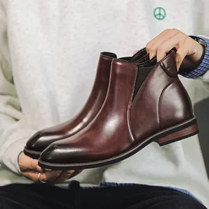 Classic men's brown leather Chelsea boots with polished finish and stylish design