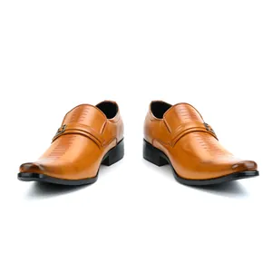 Close-up of brown leather men's business loafers with buckle and striped embossed detail