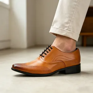 Close-up of brown leather men's dress shoe with textured burnished toe detail