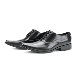 Detailed side view of elegant black men's dress shoes with textured pointed toe and lace-up design