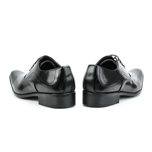 Rear view of elegant black men's business leather shoes with textured toe detail