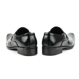 Detailed back view of classic black men's business loafers with a polished finish.