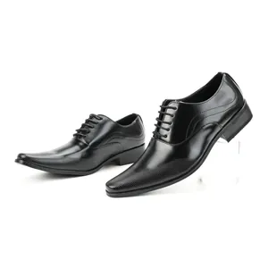 Detailed side view of elegant black leather men's business dress shoes with pointed toe.