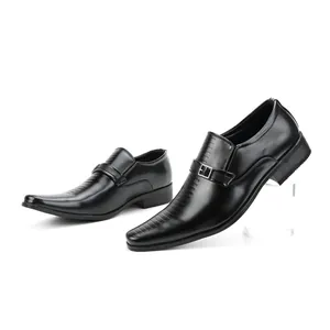 Close-up of black men's business loafers with decorative buckle and square toe