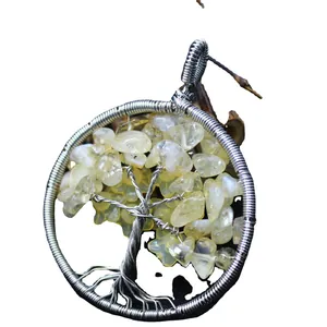 Handmade silver wire-wrapped tree of life pendant with pale yellow crystal stones