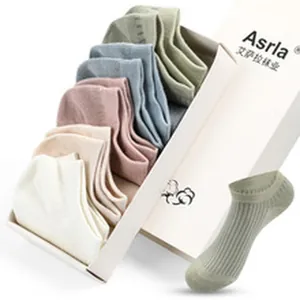 Detailed view of pastel cotton low-cut boat socks set in a white presentation gift box